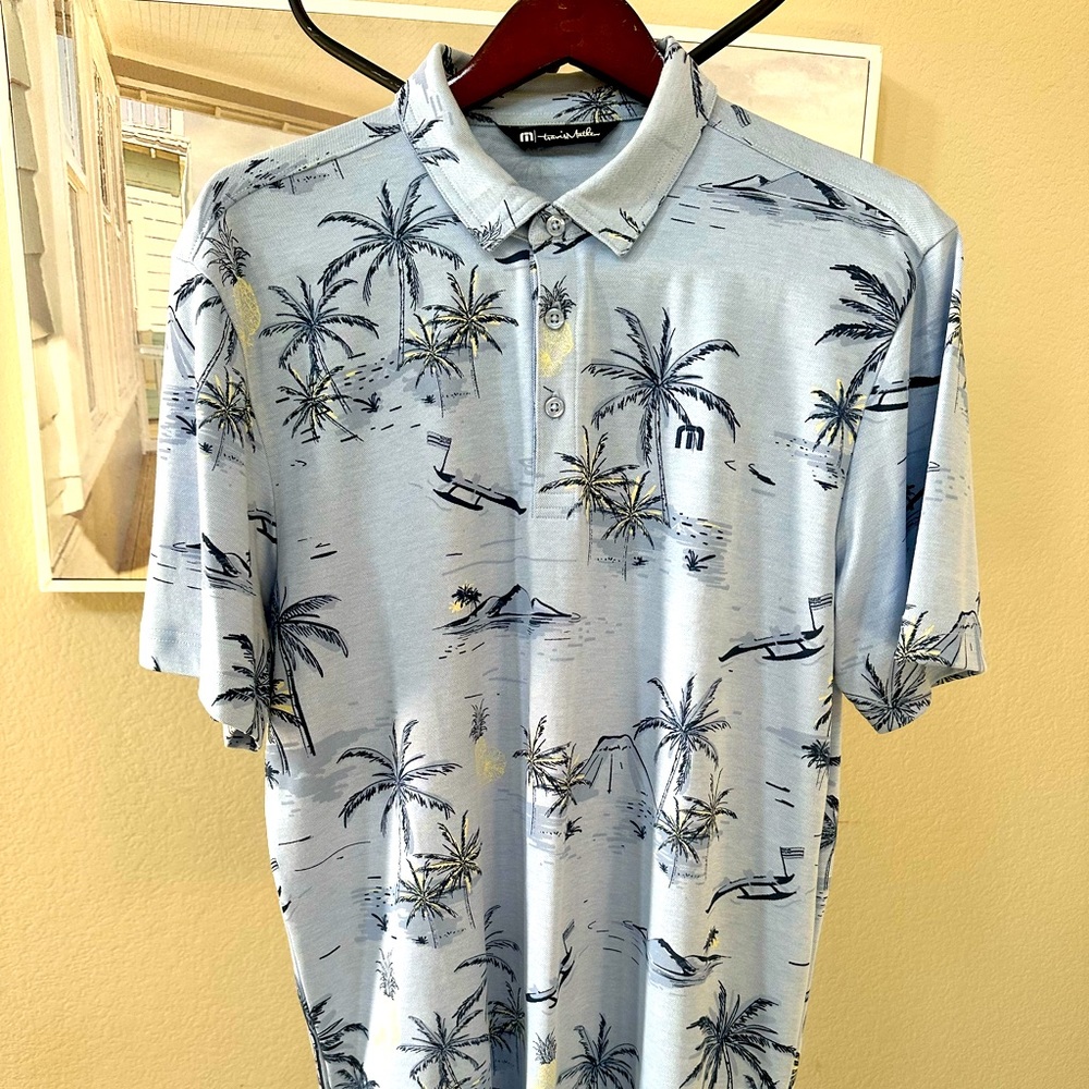Travis Mathew Light blue with navy hawaiian tropical floral golf leisure polo